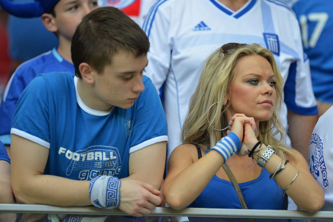 Greek fans wait for the start of the Euro 2012 championships football against Russia